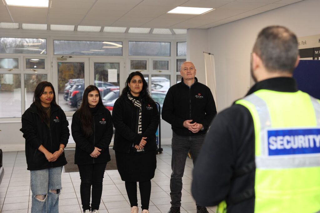 Security training session where the security team is learning about modern UK security threats, including public safety risks and situational awareness techniques.