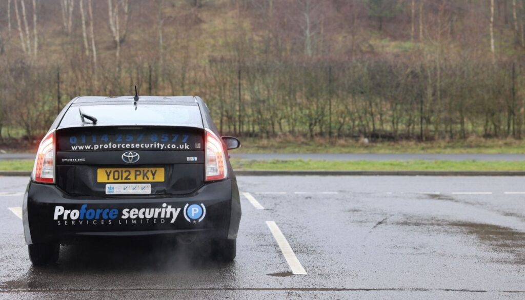 SIA licensed mobile patrol company vehicle outside a UK commercial premises during an evening security patrol.